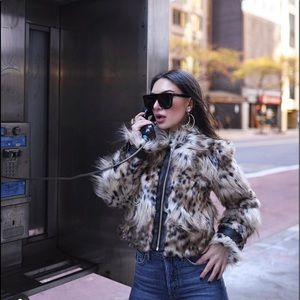 Very stylish short faux fur jacket.